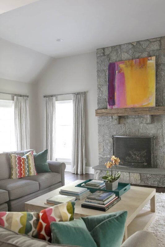 Image of neutral colored room with colorful accent pieces throughout